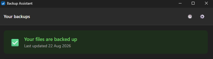 The Backup Assistant window showing a green tick and the message that your files are backed up, with the date it last ran.
